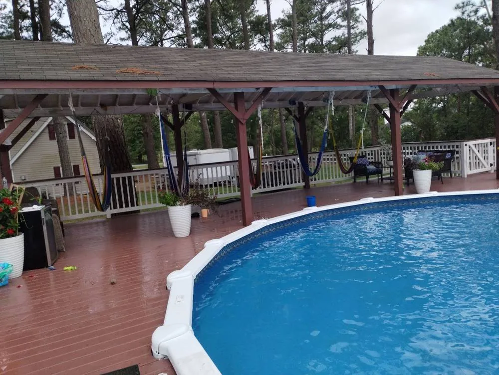 Above-ground pool photographed during a seasonal Pool Store service visit