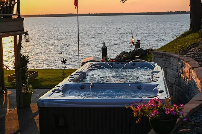 Garden Leisure swim spa beside a patio at sunset