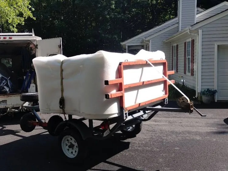 Hot tub secured on delivery equipment during a Pool Store placement project