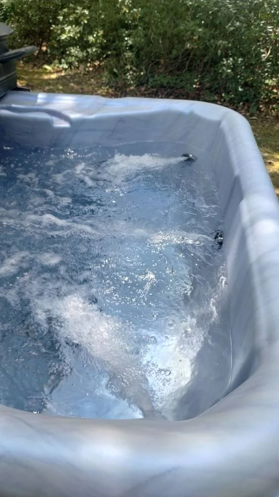 Seating and jets inside a Nordic hot tub from a Pool Store installation