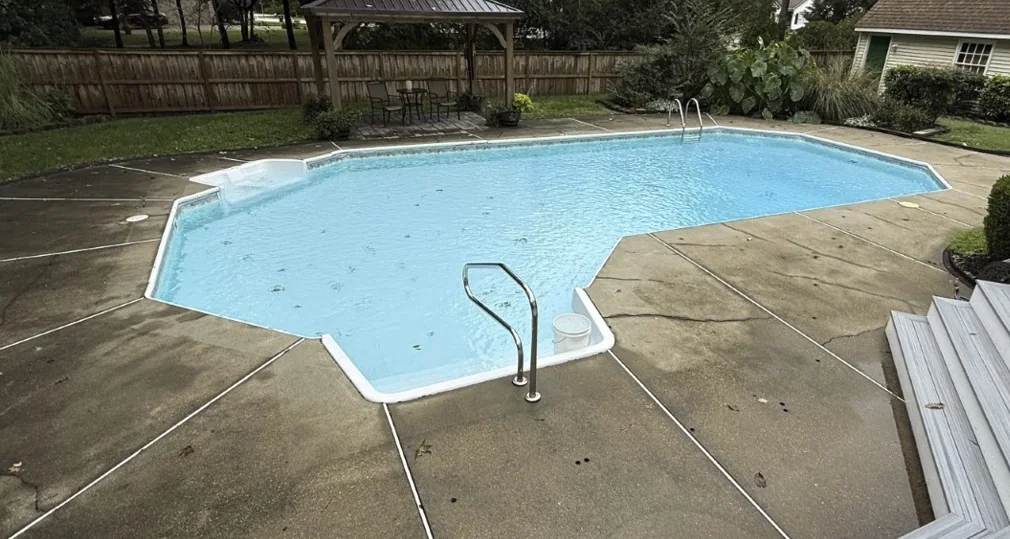 Residential pool and surrounding deck photographed during a Pool Store inspection